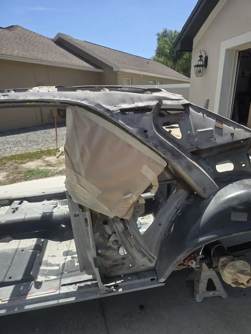 Project car body blasted down to clean bare metal after blasting