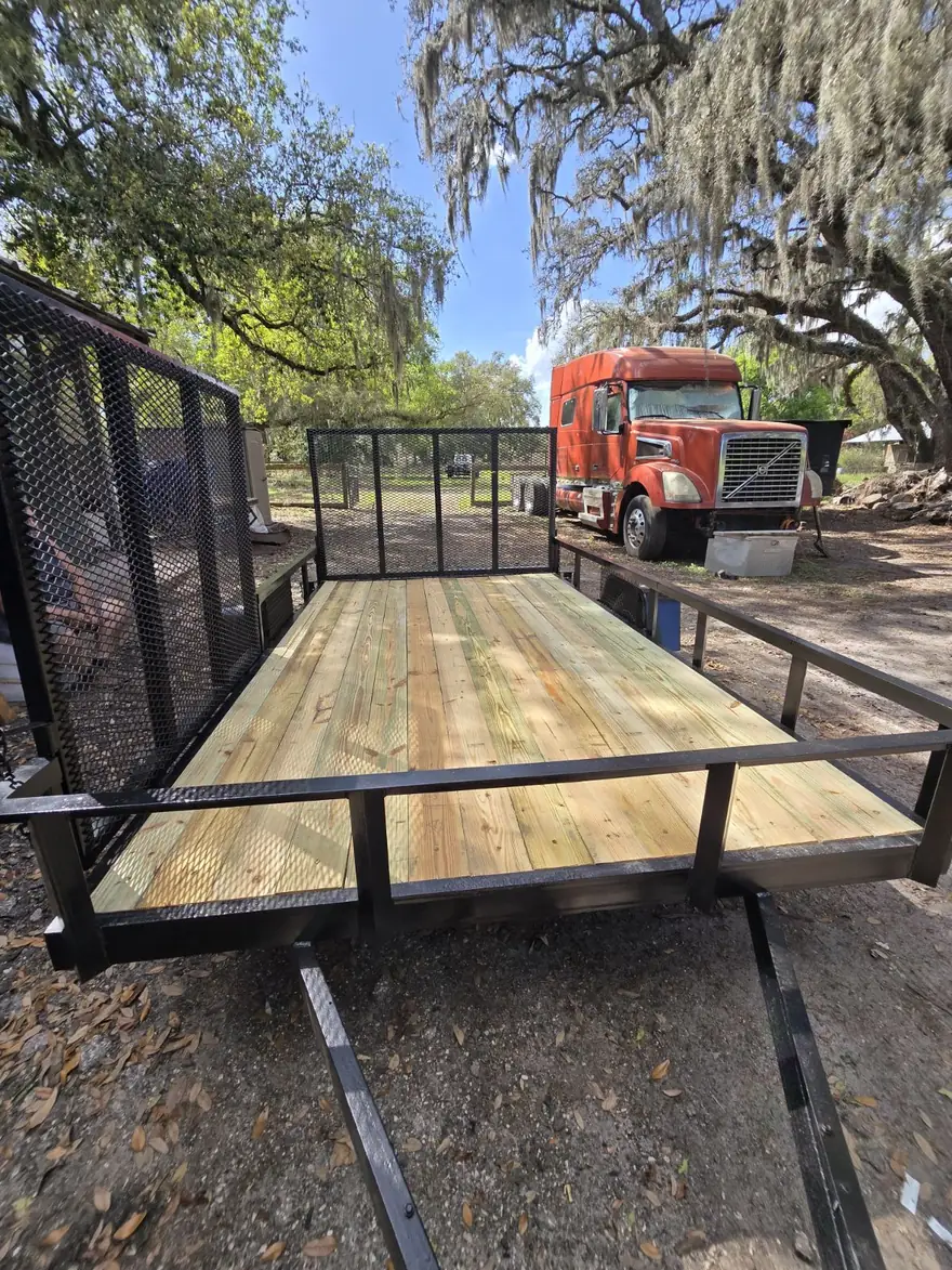 Trailer frame stripped to bare metal, recoated, and fitted with a new wood deck after blasting